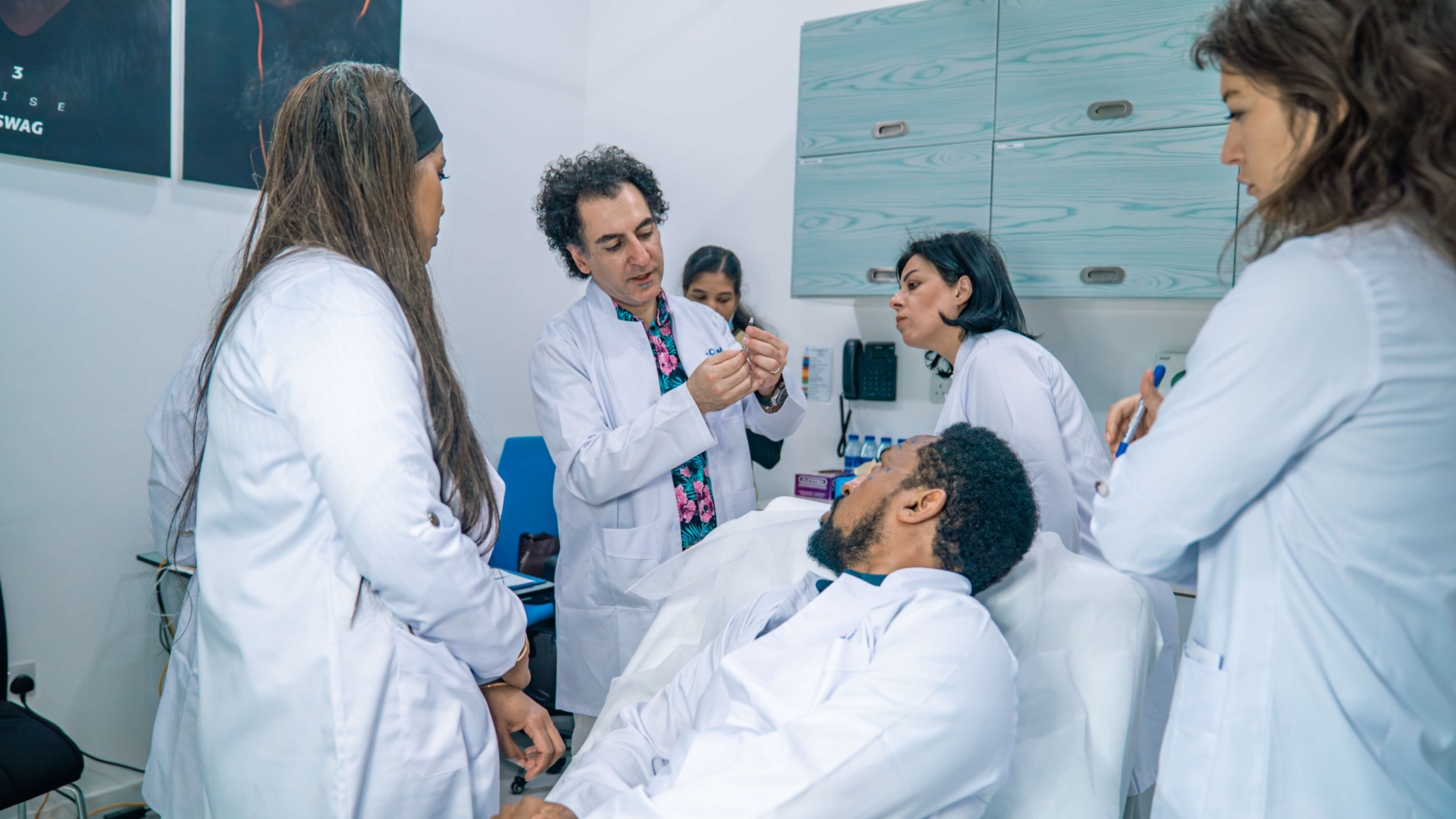 Medical team around a patient in a clinical setting